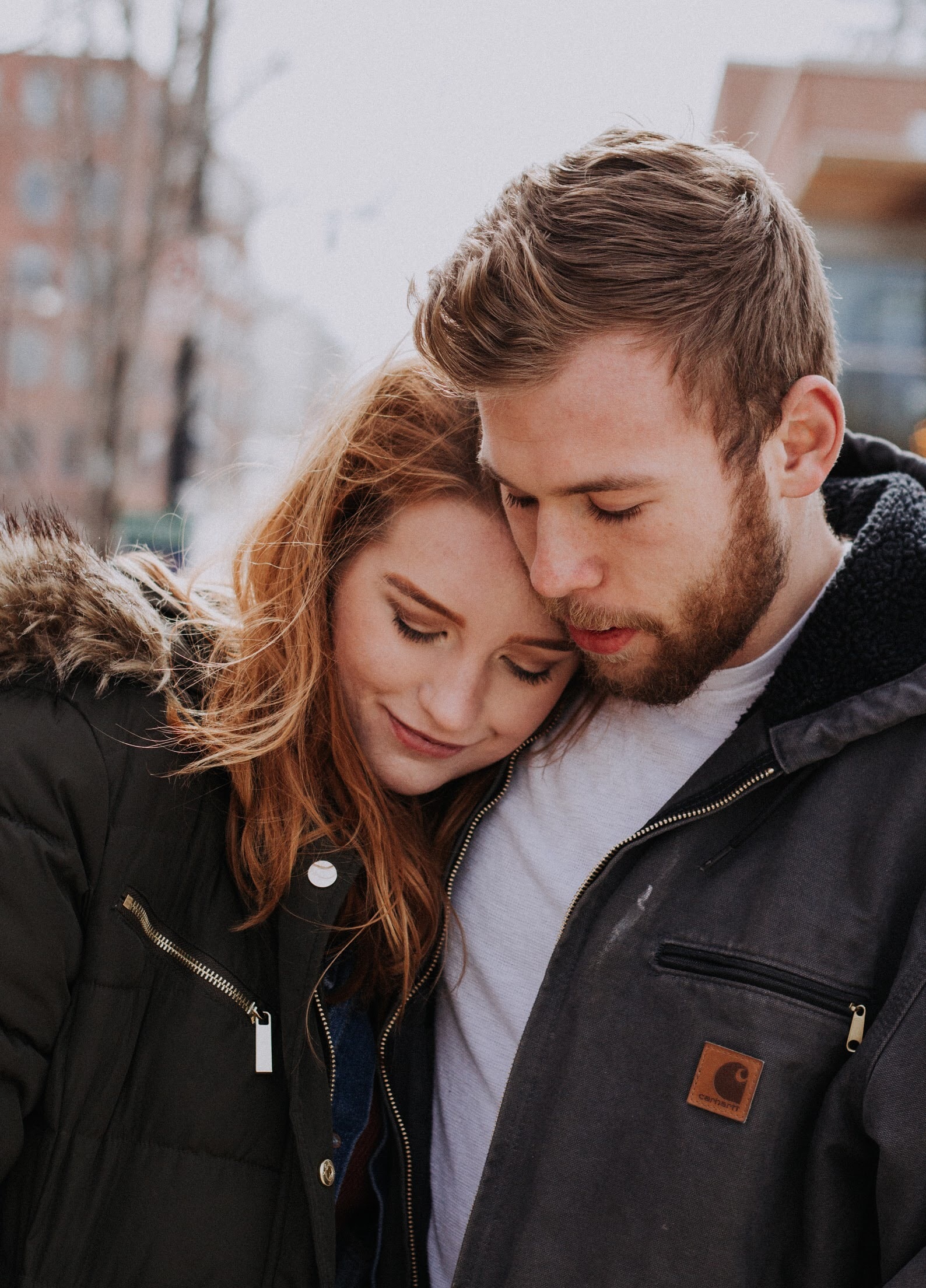Young woman and man hugging